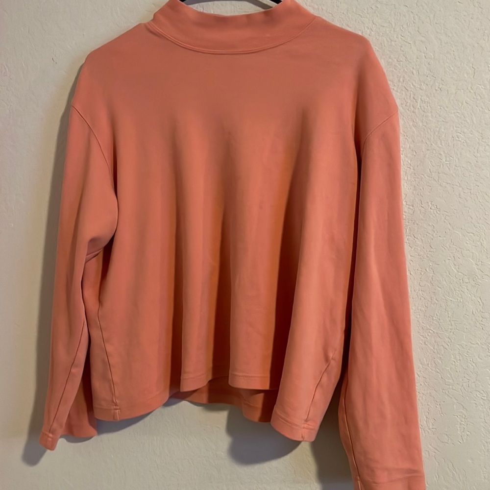 Light pink woman’s large sweater